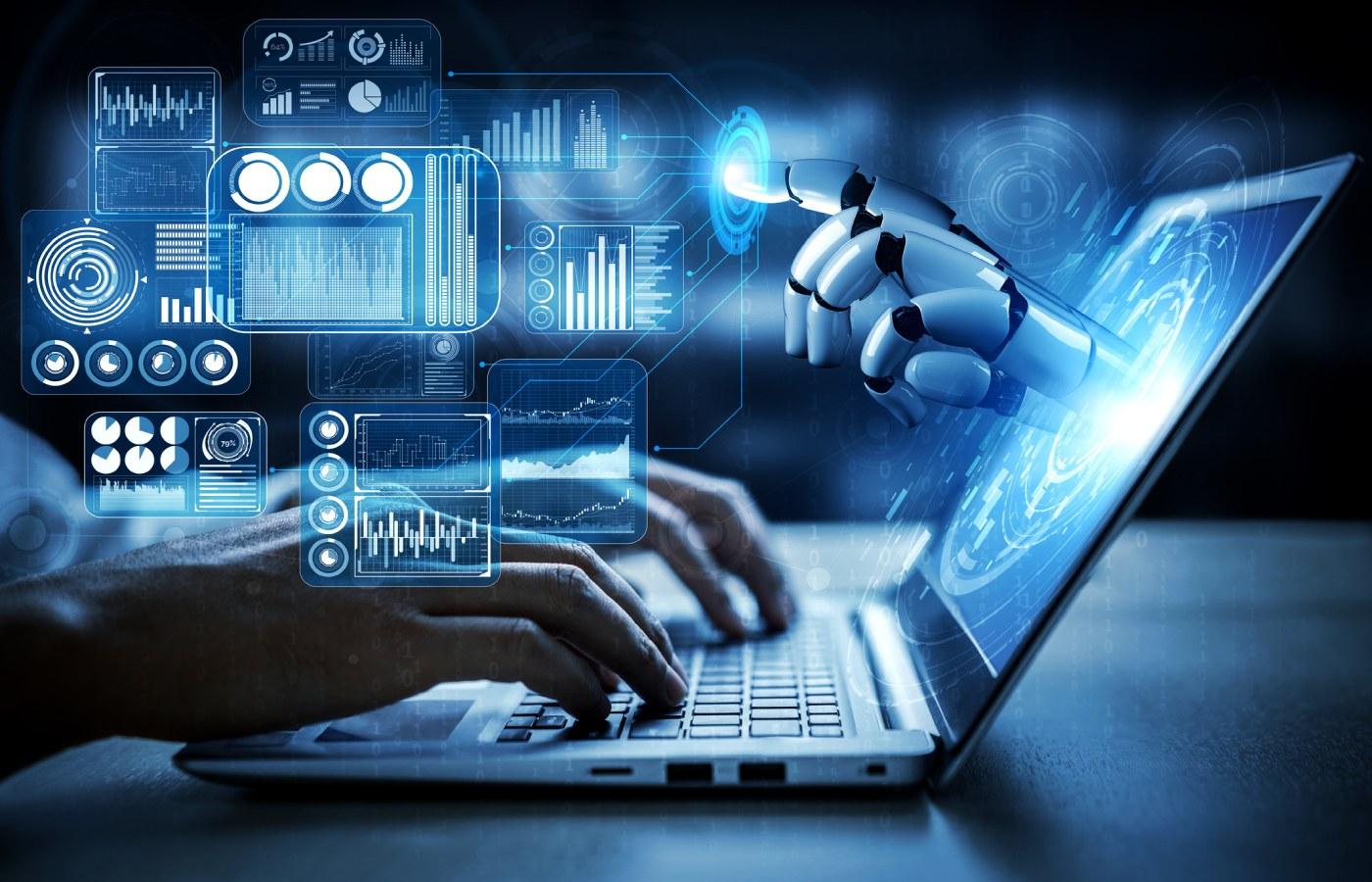 A businessman typing on a laptop and interacting with AI and robotics