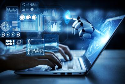 A businessman typing on a laptop and interacting with AI and robotics